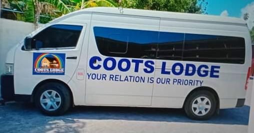 Coots Lodge branded shuttle van for guest transportation.
