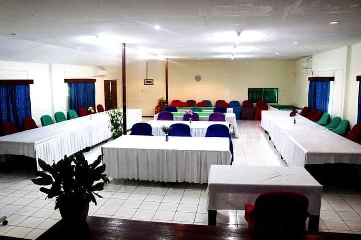 Spacious indoor conference or function room with banquet seating.
