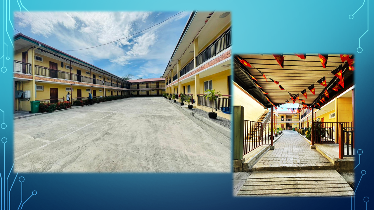 Two-story apartment blocks with balcony access overlooking the courtyard.