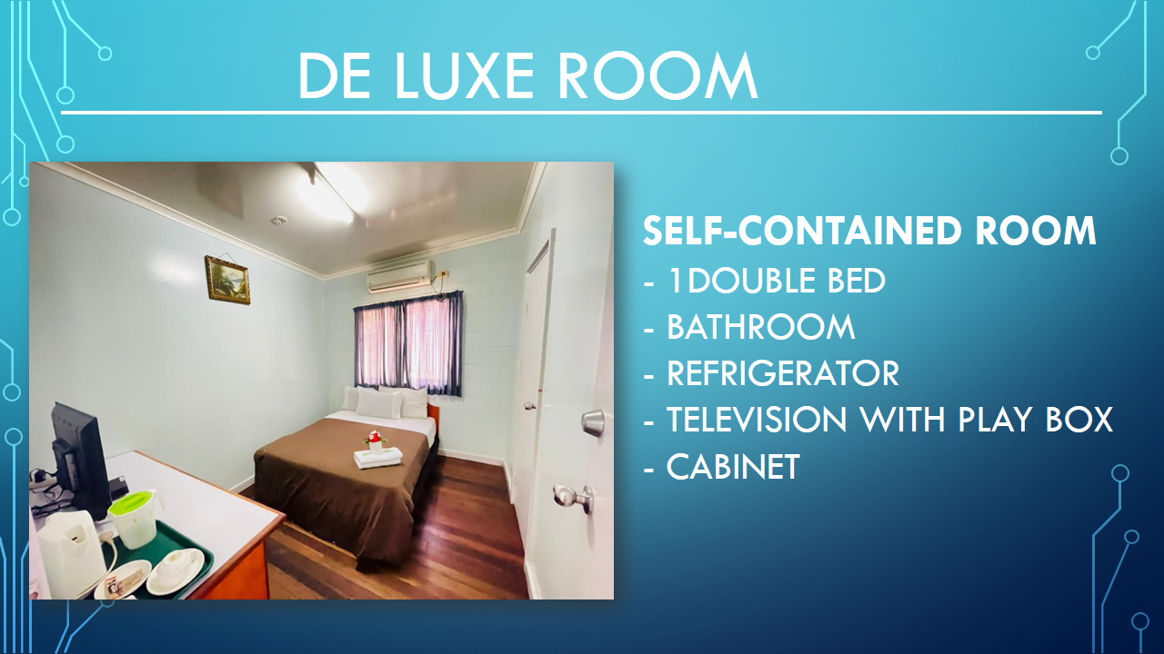Deluxe room with wood-style flooring, a double bed, and air conditioning.