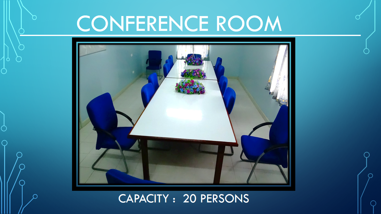 On-site conference room with a long meeting table and blue seating for 20.