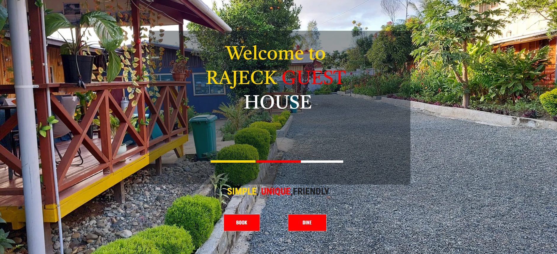 Gravel driveway and landscaped garden leading to the guest house building.