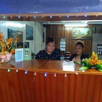 Wooden reception desk at the motel entrance lobby.