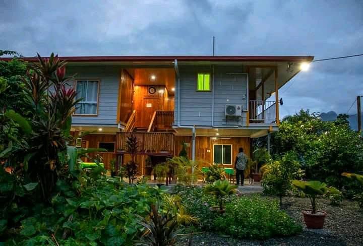 Dusk exterior of the lodge illuminated by outdoor lighting