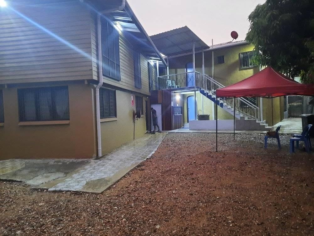 Internal courtyard area with gravel ground and stairs to upper floor.