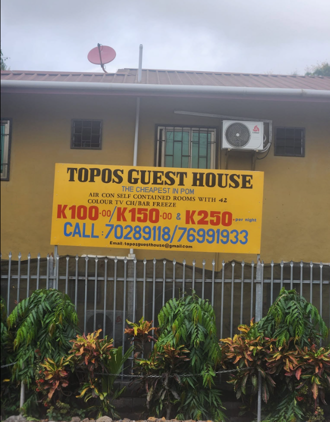 Yellow advertising board displaying pricing and contact information.
