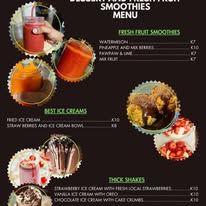 Digital menu board displaying smoothies, ice creams, and thick shakes.