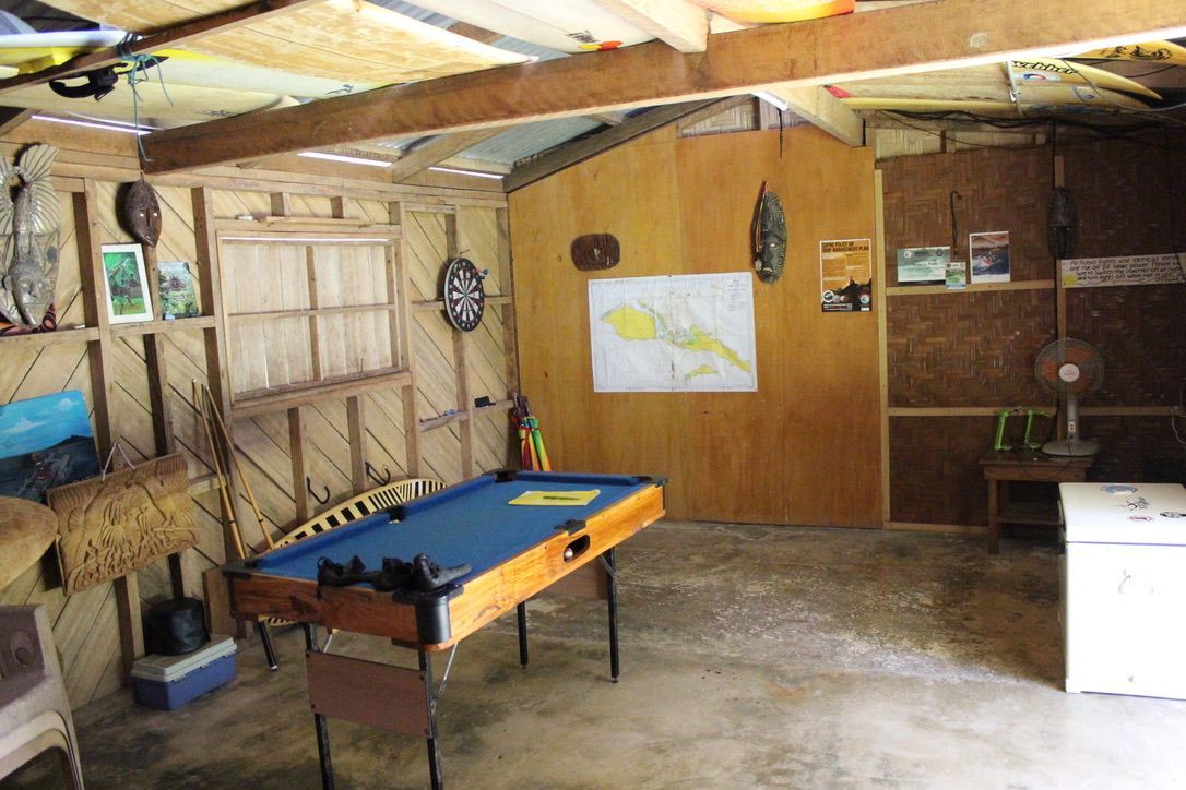 Recreation room featuring a pool table and local decorations.