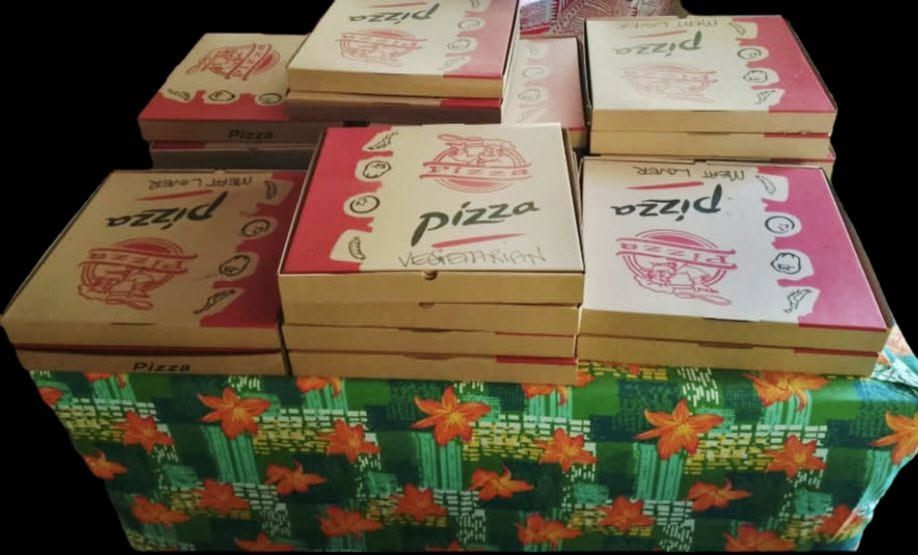 Stacks of pizza boxes for a resort meal service