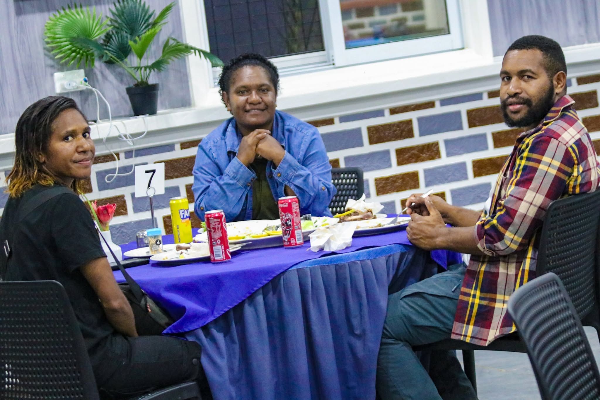 Diners at a table with blues linens in the restaurant area