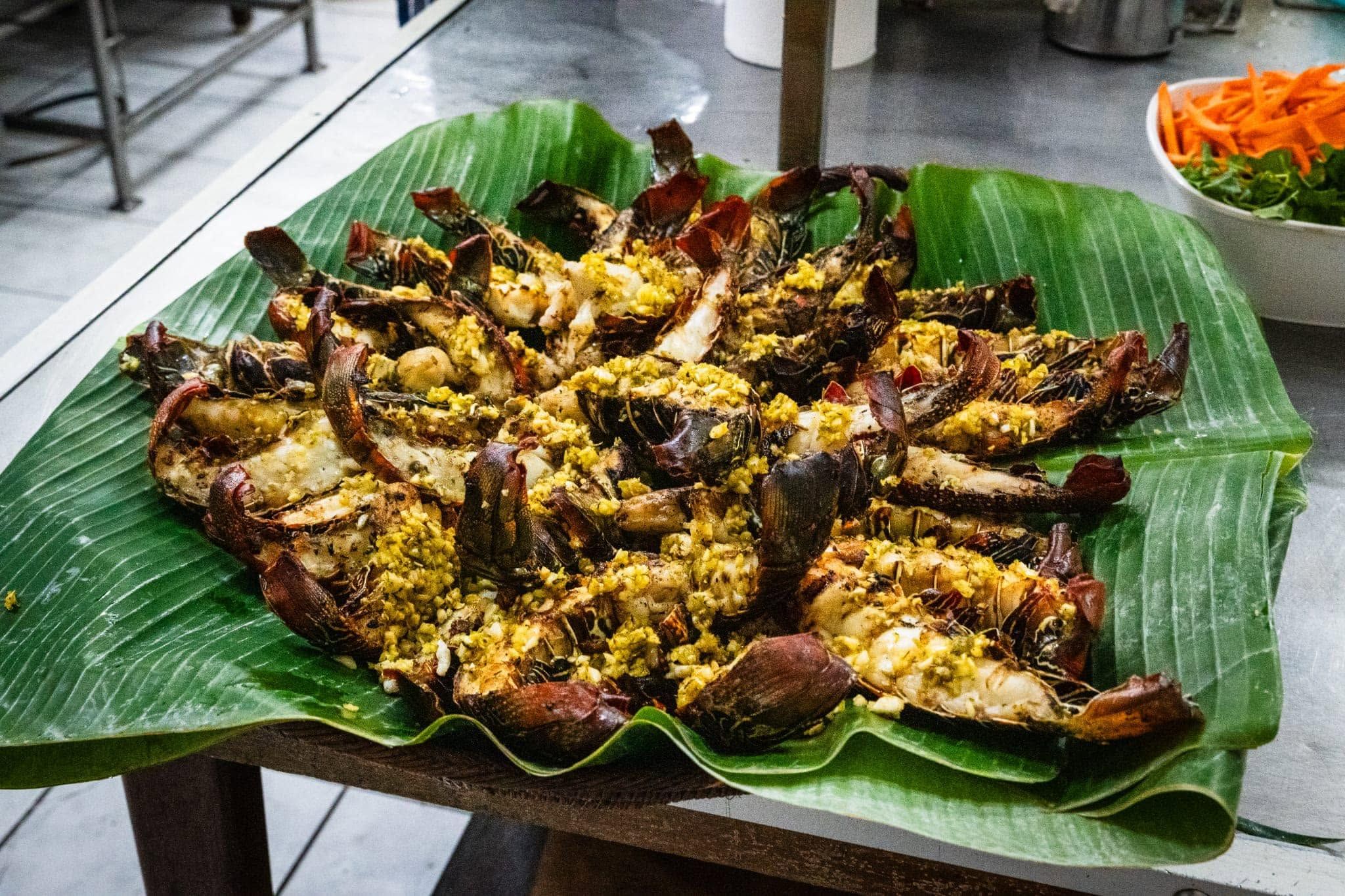 Grilled seafood served on banana leaves at Walindi Plantation Resort.