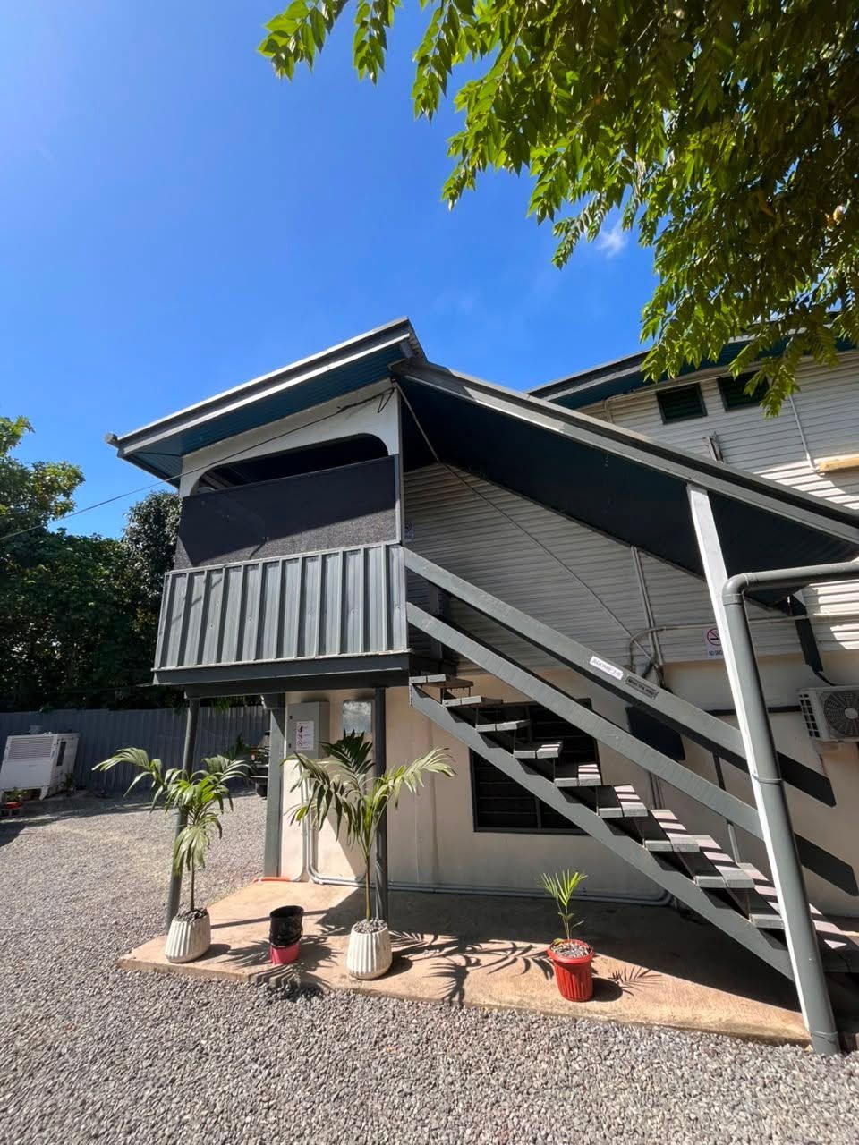 Outdoor staircase leading to the upper level of the motel building
