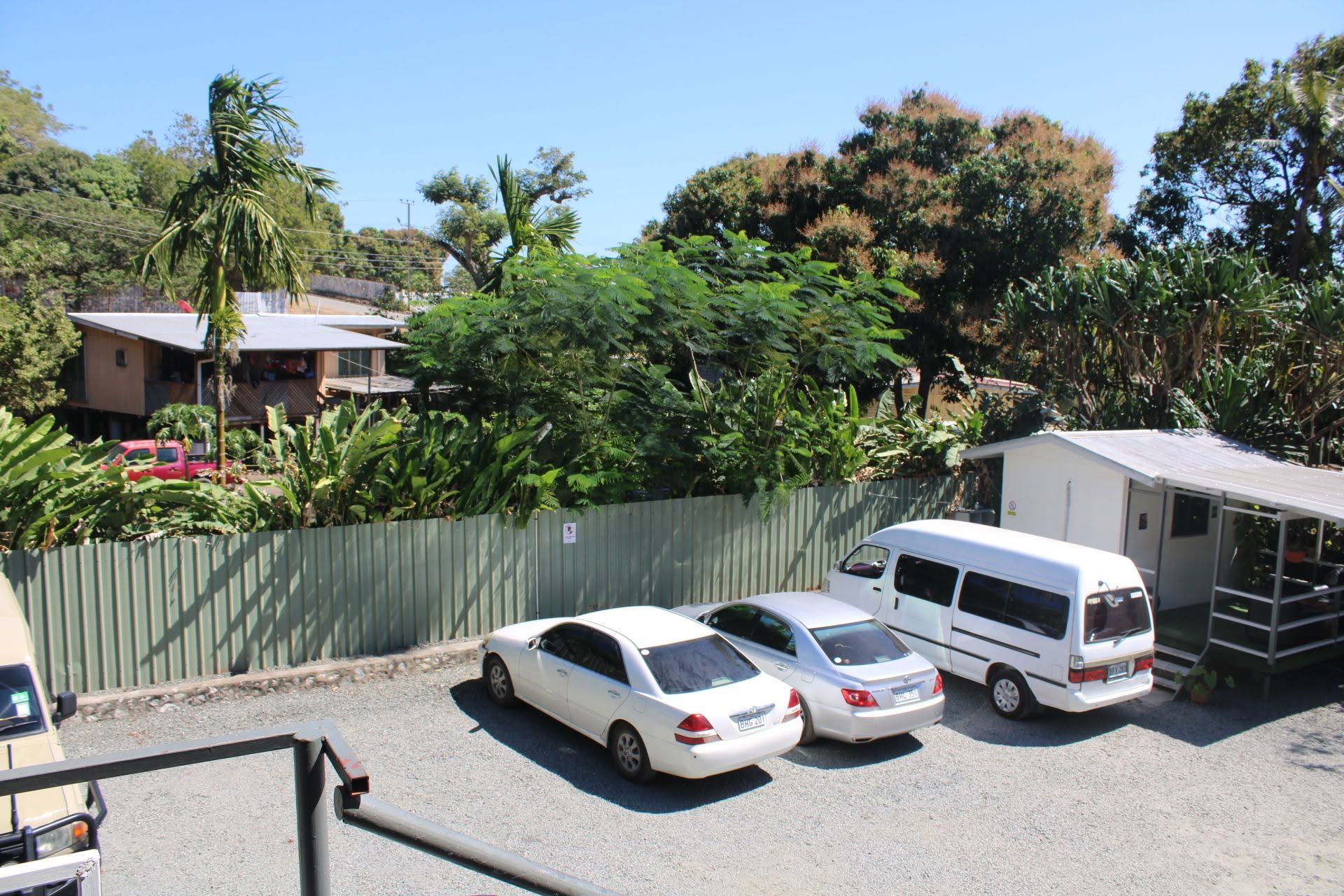 Elevated view of the gravel parking area and onsite support buildings
