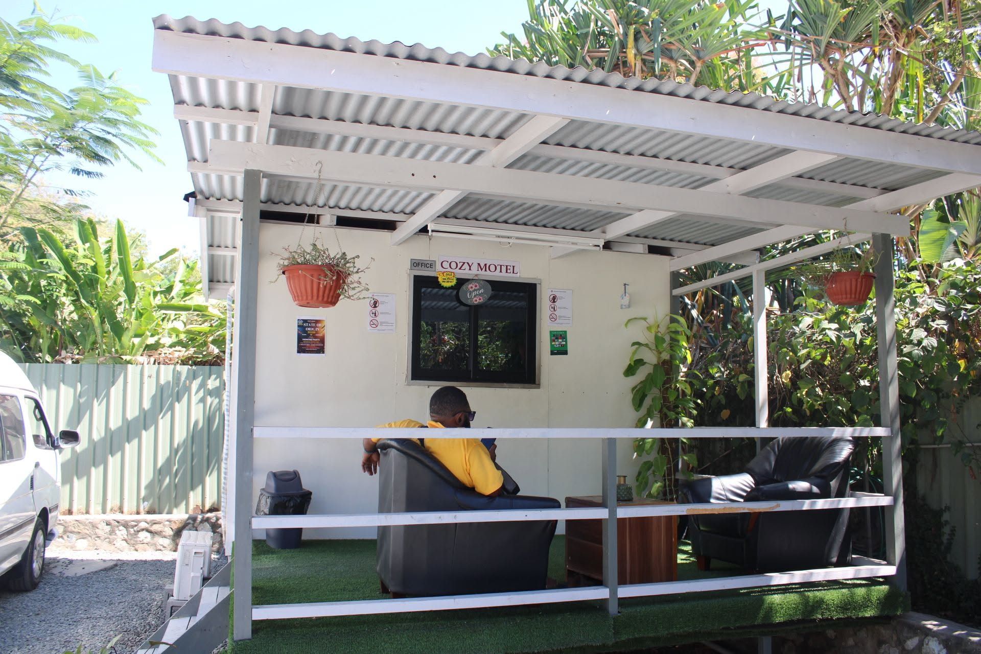 Covered reception kiosk with seating area for guests