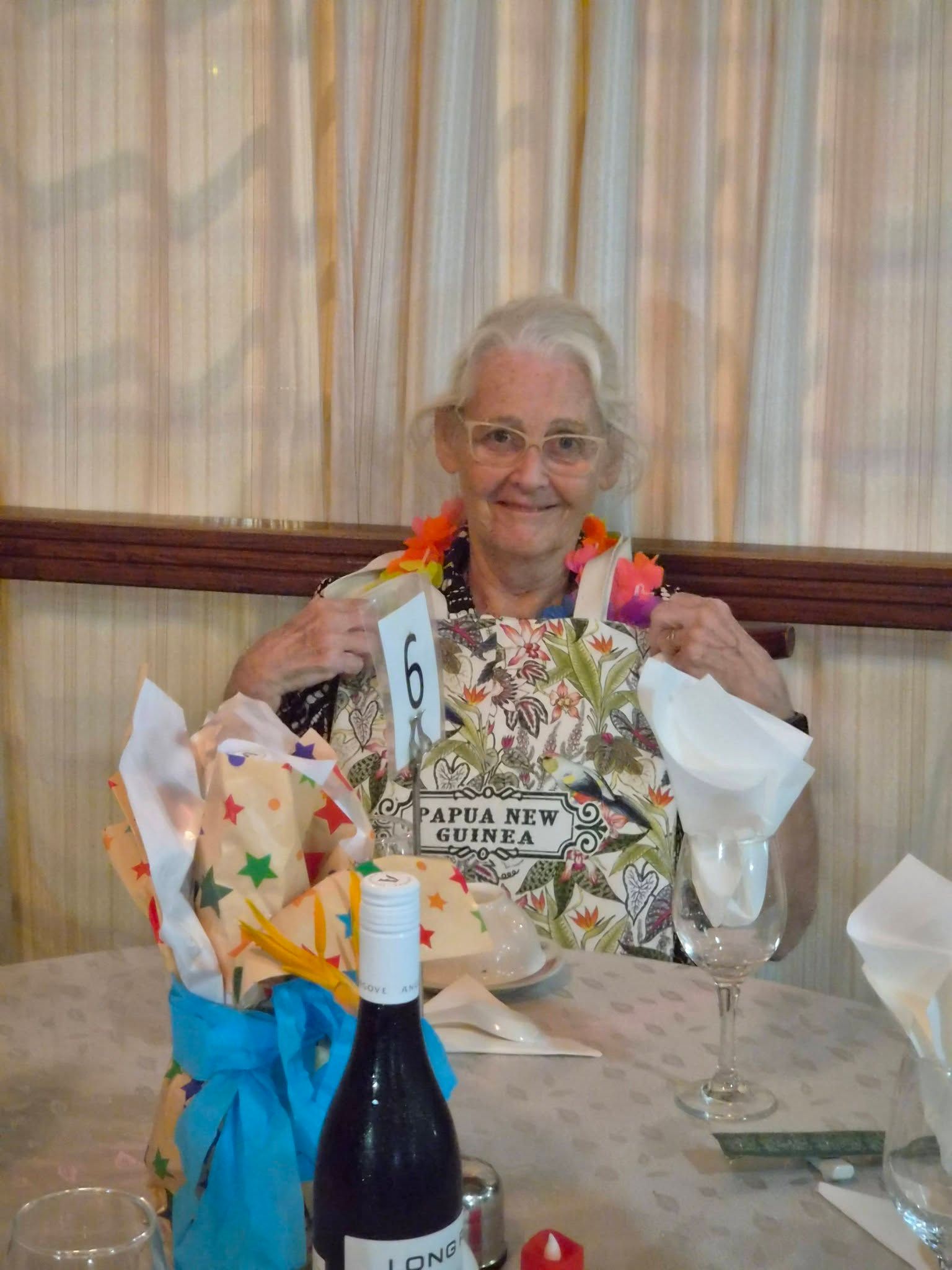 A guest sitting at a decorated dining table in the hotel restaurant.