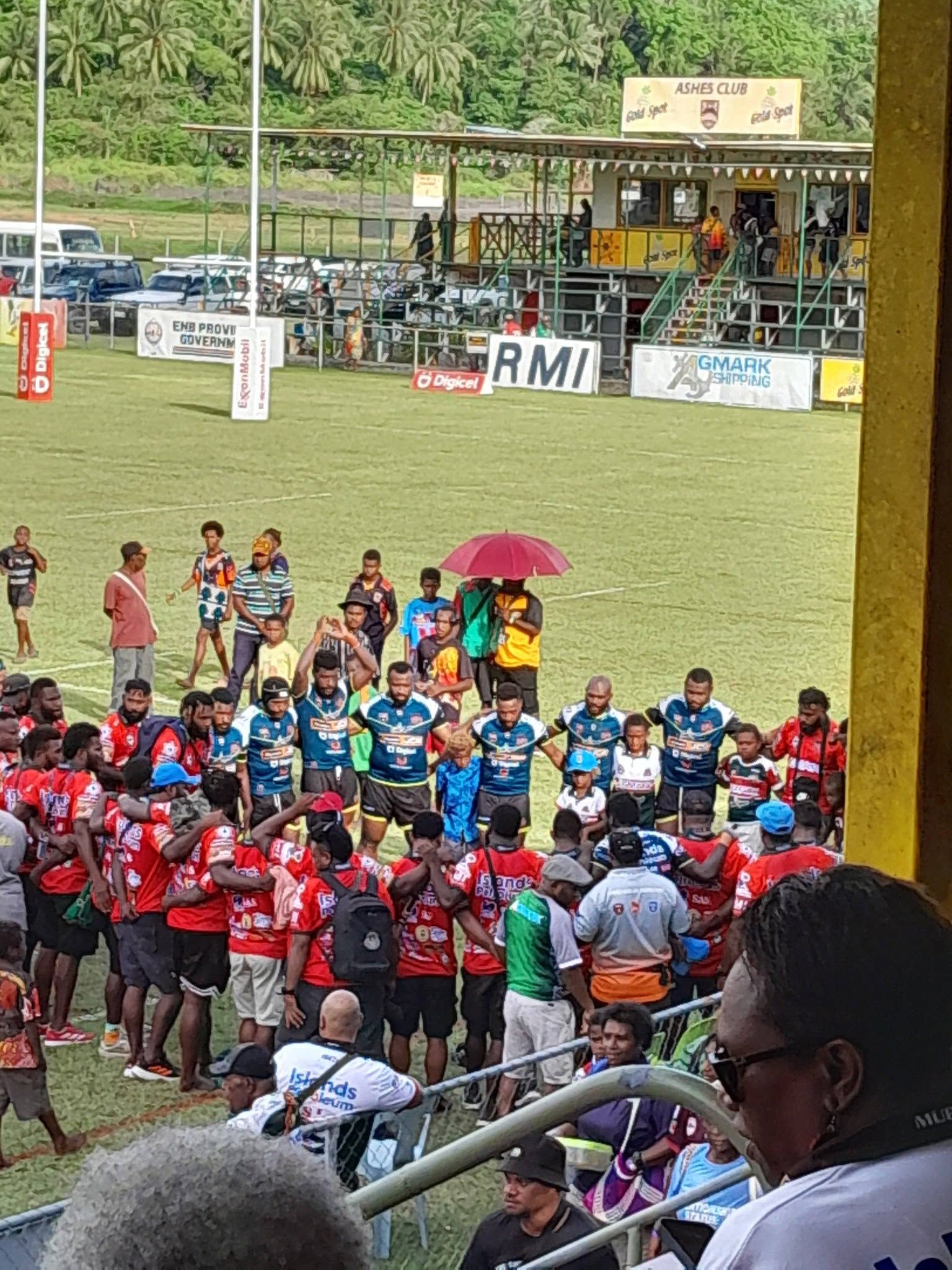 A local sports team gathering at a field in the Rabaul area.