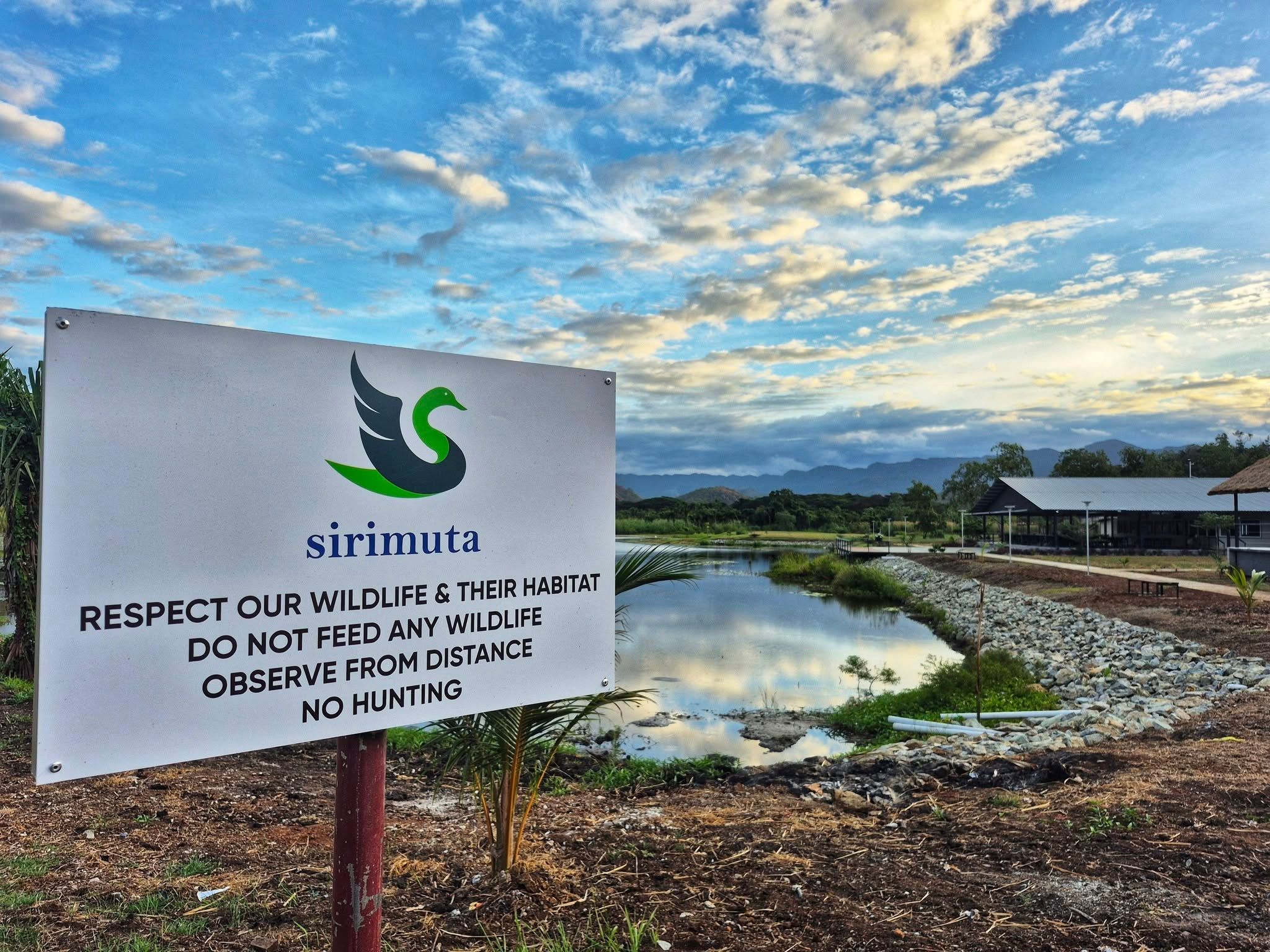 Information sign about wildlife respect located on the resort lakefront.
