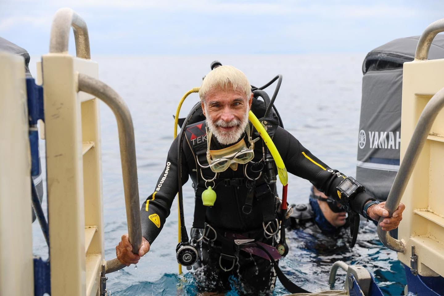Diver equipped with scuba gear returning to the vessel