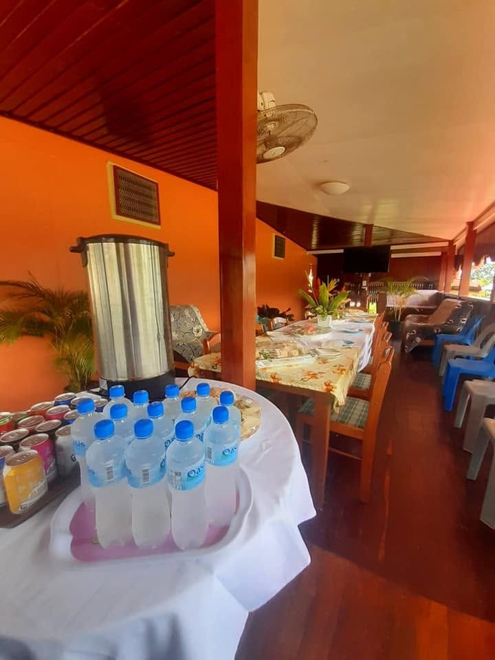 Refreshments station with bottled water and hot drinks.