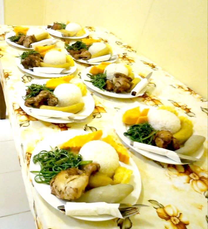 A row of prepared plating for guest meal service.